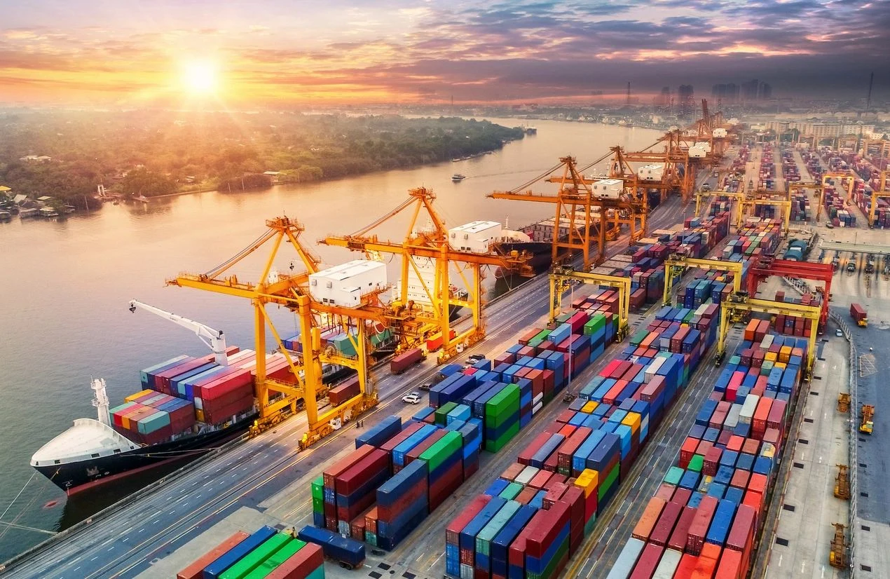 Global trade infrastructure and a container port at sunrise
